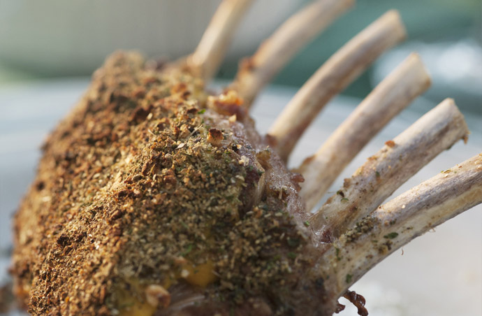 Close up photograph of a pork belly with a Rub seasoning.